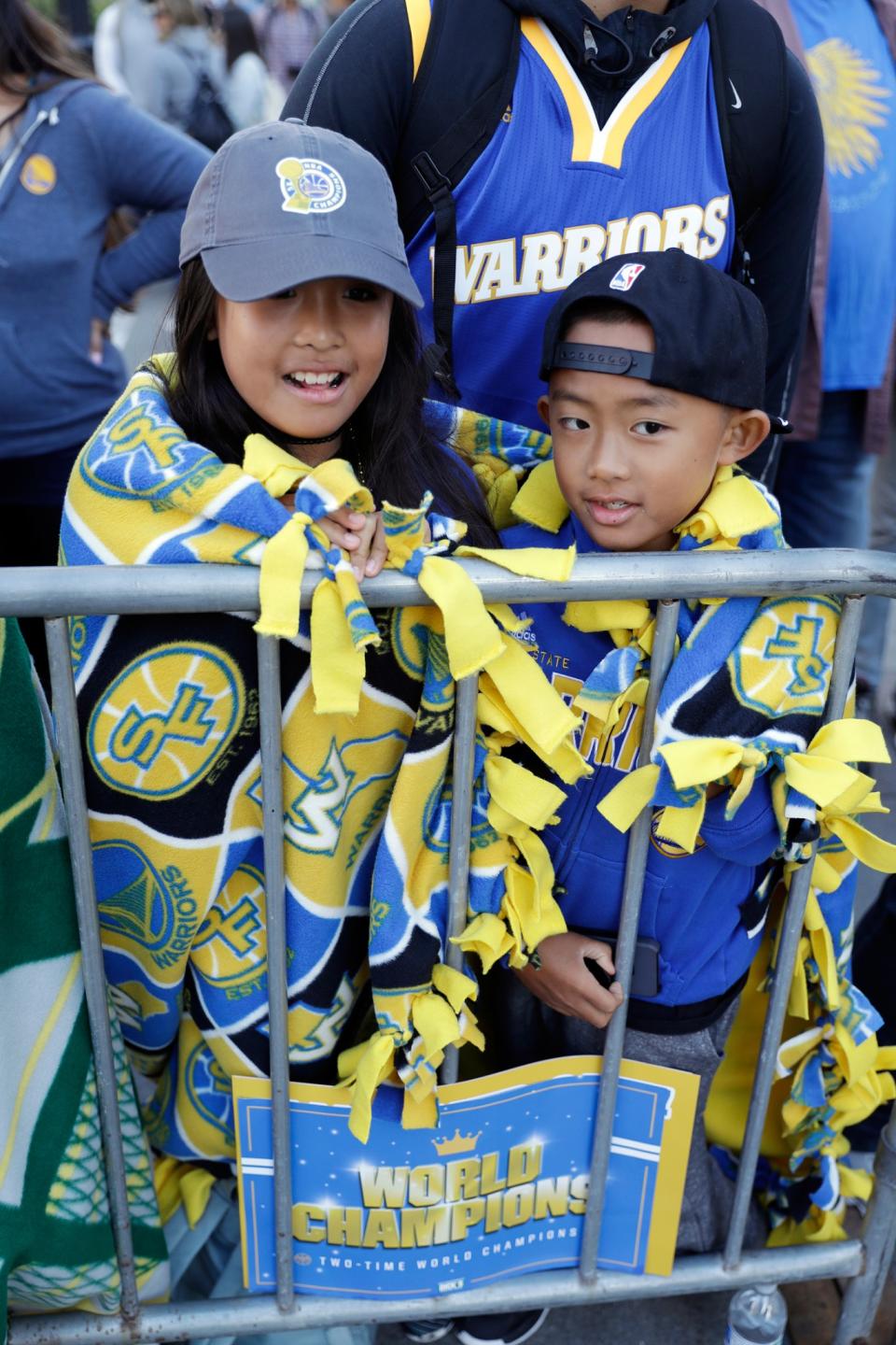 <p>Makayla Ranola, left, and her brother Devyn wrap themselves in blankets as they wait for a parade and rally to start in honor of the Golden State Warriors, Thursday, June 15, 2017, in Oakland, Calif., to celebrate the team’s NBA basketball championship. (AP Photo/Marcio Jose Sanchez) </p>