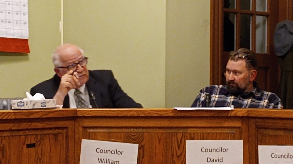 Honesdale Borough Councilor William McAllister, at left, discusses his proposal to raise the 2024 tax millage by one mill and eliminate the Earned Income Tax that was approved three weeks before. At right is councilor David Nilsen at the meeting at City Hall, Nov. 27, 2023. The new tax rate will be 6.58.