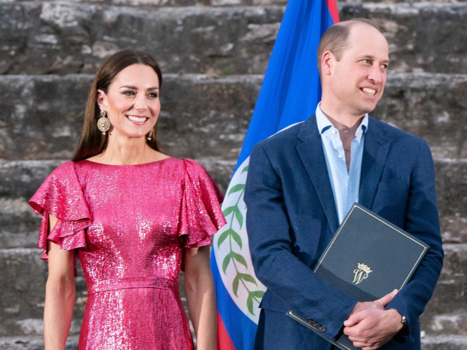 Kate in a pink sparkly dress. William in a blue suit and button down.