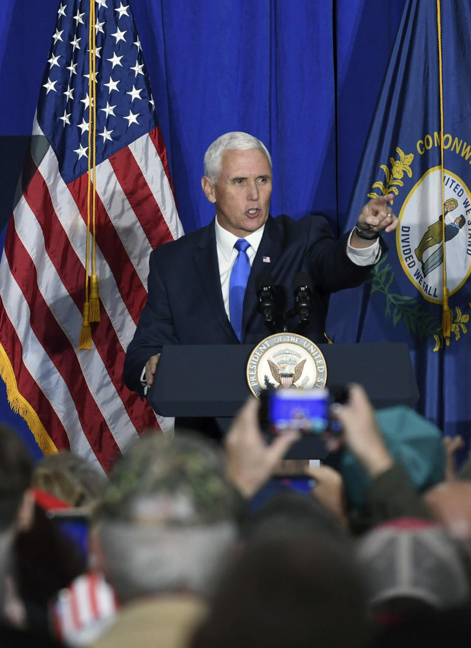 Vice President Mike Pence points to a sign while campaigning for Kentucky Gov. Matt Bevin, Friday, Nov. 1, 2019 in London, Ky. Attempting to turn the Kentucky governor's race into a referendum on impeachment, Vice President Mike Pence urged voters Friday to register their disgust with the "endless investigations" of President Donald Trump by reelecting his close ally, Republican Gov. Matt Bevin.(John Flavell/Lexington Herald-Leader via AP)