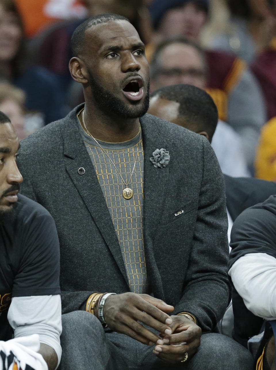 Cleveland Cavaliers' LeBron James watches from the bench in the first half of an NBA basketball game against the Toronto Raptors, Wednesday, April 12, 2017, in Cleveland. (AP Photo/Tony Dejak)