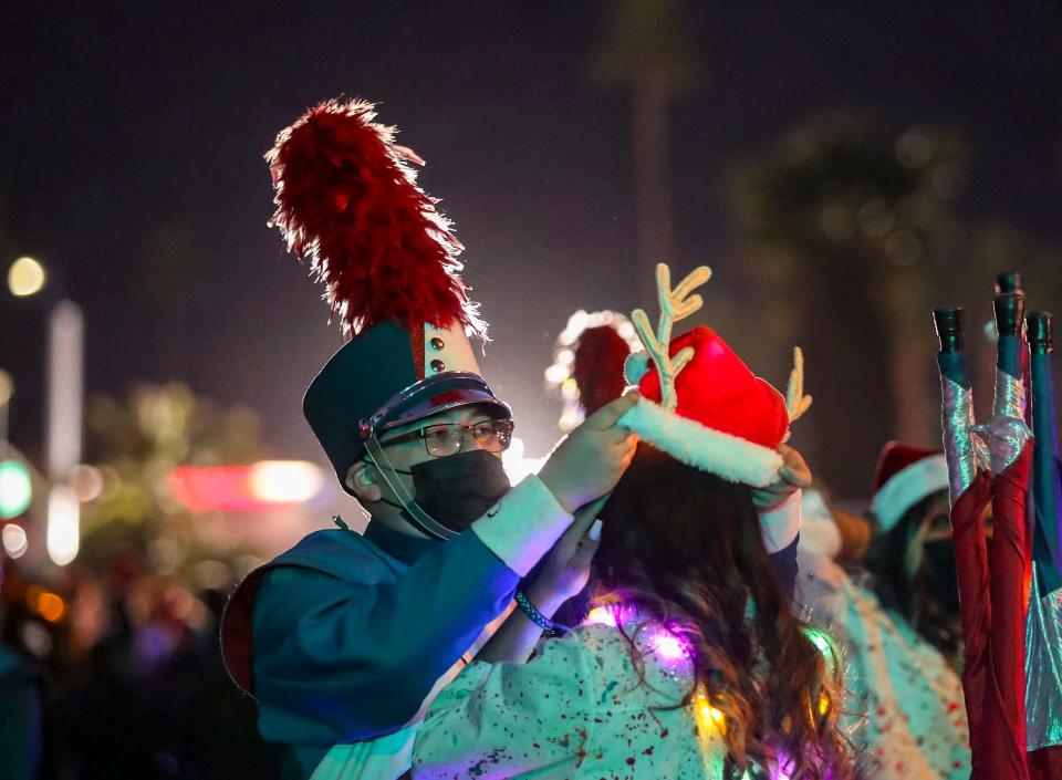 Members of the Indio High School band prepare before the start of the Festival of Lights Parade, Saturday, Dec. 4, 2021, in Palm Springs, Calif. 