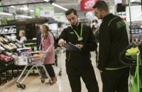 FILE PHOTO: Employees check stock at the Asda superstore in High Wycombe, Britain, February 8, 2017. REUTERS/Eddie Keogh/File Photo