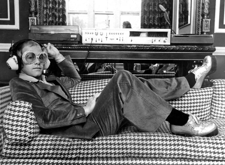 <p>Elton John listening to music on Sony hi-fi equipment in 1974.</p>