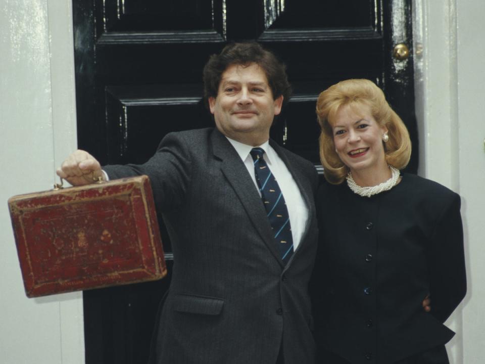 Nigel Lawson with his wife Therese Maclear outside 11 Downing Street on Budget Day in March 1987 (Getty)