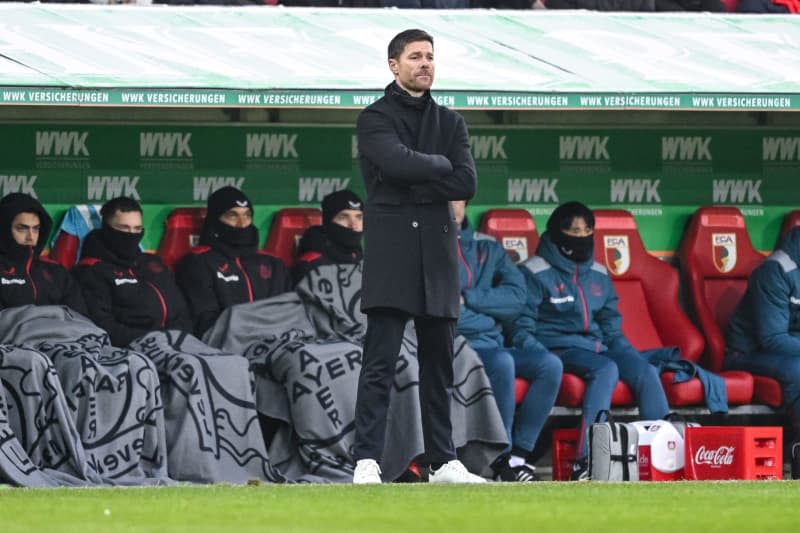 Leverkusen coach Xabi Alonso watches the game from the touchline during the German Bundesliga soccer match between FC Augsburg and Bayer Leverkusen at the WWK Arena. Harry Langer/dpa