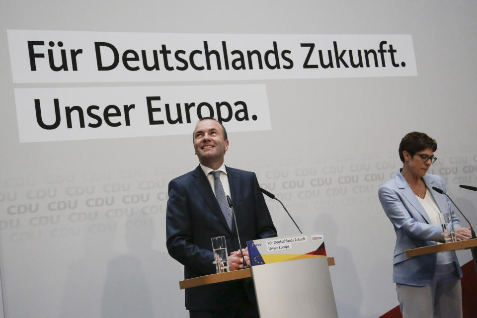 Annegret Kramp-Karrenbauer, right, Chairwoman of the Christian Democratic Union, CDU, attends a statement with European People's Party top candidate Manfred Weber, left, at the CDU headquarters in Berlin, Sunday, May 26, 2019. (AP Photo/Markus Schreiber)