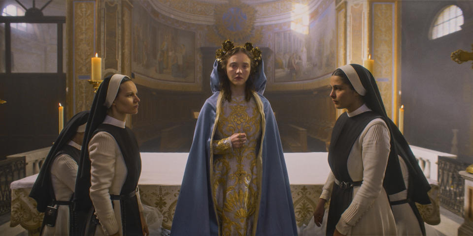 This image released by Neon shows Sydney Sweeney, center, in a scene from the film "Immaculate." (Neon via AP)