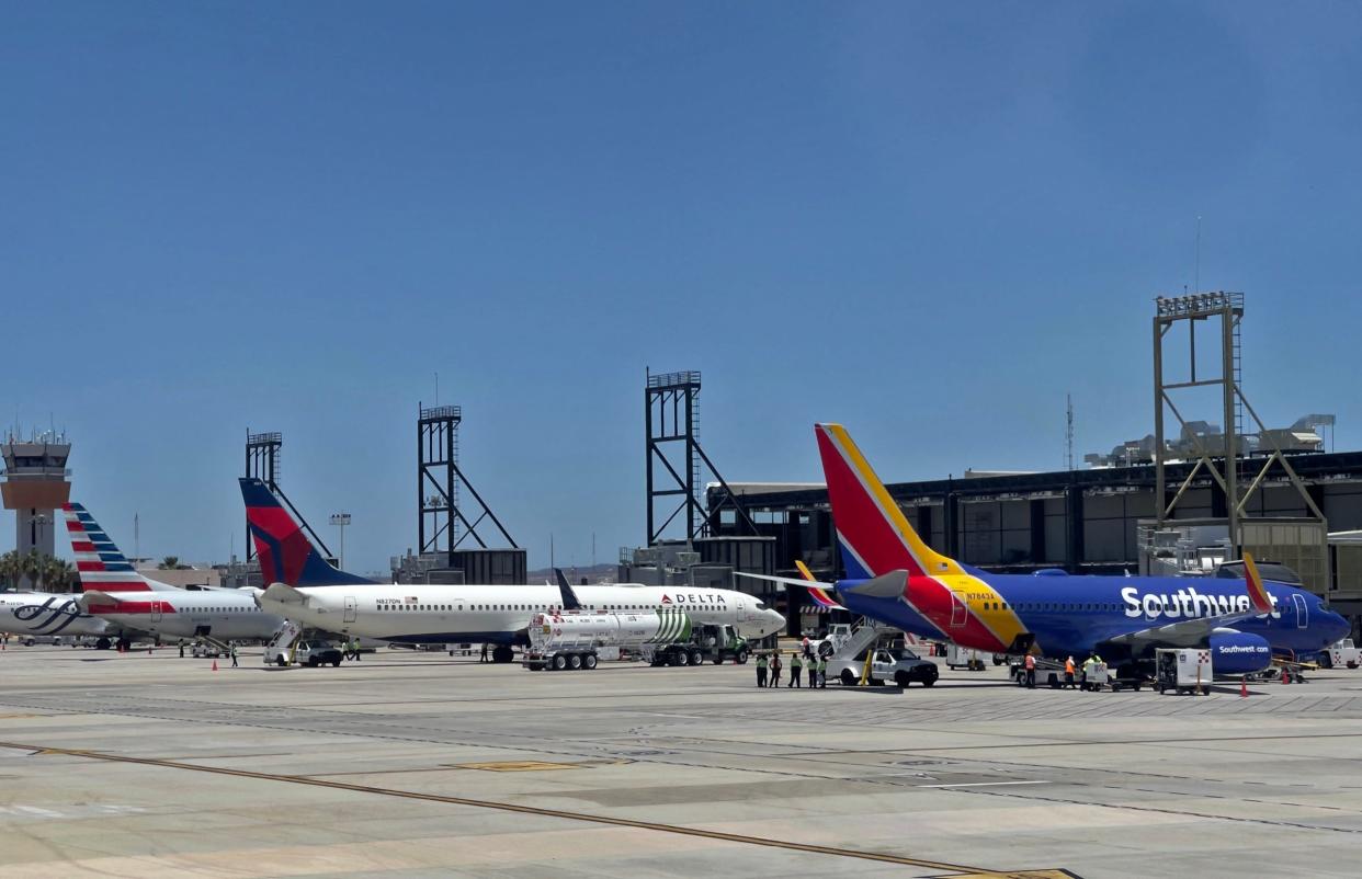 Southwest Airlines, Delta Air Lines, and American Airlines aircraft at an airport.