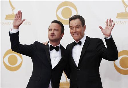 Actors Aaron Paul (L) and Bryan Cranston from AMC's series "Breaking Bad" arrive at the 65th Primetime Emmy Awards in Los Angeles September 22, 2013. REUTERS/Mario Anzuoni