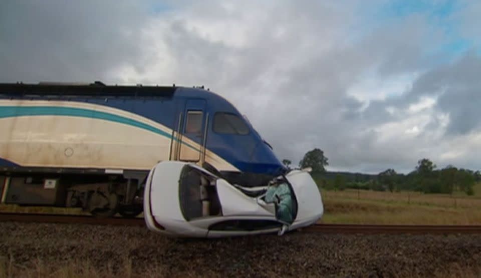 The train pushed the Holden Commodore down the line. Photo: 7 News