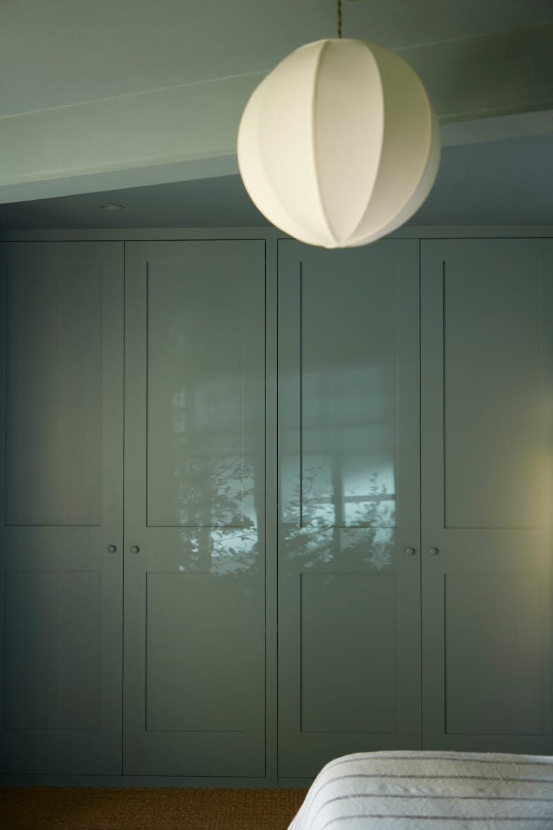 Pendant lamp hung near built in closets.