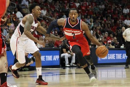 May 3, 2015; Atlanta, GA, USA; Washington Wizards guard John Wall (2) drives to the basket against Atlanta Hawks guard Jeff Teague (0) in the first quarter in game one of the second round of the NBA Playoffs. at Philips Arena. Mandatory Credit: Brett Davis-USA TODAY