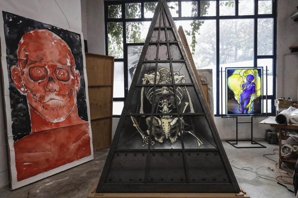 Italian artist Narcissus Quagliata's works stand in his studio in Valle de Bravo, Mexico, Wednesday, Oct. 25, 2023. Quagliata is a renowned glass artist in Mexico. (AP Photo/Ginnette Riquelme)