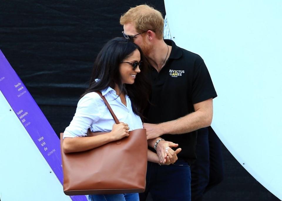 Here they are holding hands for the camera.