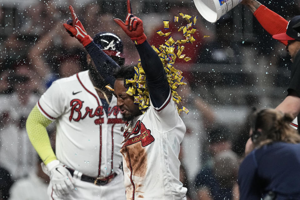 CORRECTS TO THREE-RIN HOME RUN NOT TWO-RUN HOME RUN - Atlanta Braves' Ozzie Albies celebrates after hitting a winning three-run home run in the 10th inning of a baseball game against the New York Mets, Thursday, June 8, 2023, in Atlanta. (AP Photo/John Bazemore)