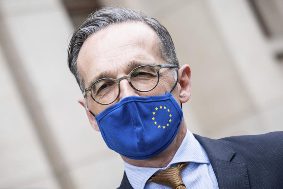 German Foreign Minister Heiko Maas, wears a face mask to protect against the coronavirus following a meeting with his Italian counterpart Di Maio at the Foreign Office in Berlin, Germany, Friday, June 5, 2020. (Michael Kappeler/Pool via AP)