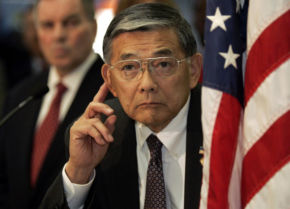 FILE - Transportation Secretary Norman Mineta listens to questions during a news conference at O'Hare International Airport, Monday, Nov. 21, 2005, in Chicago. Mineta, who broke racial barriers for Asian Americans serving in high-profile government posts and ordered commercial flights grounded after the 9/11 terror attacks as the nation's federal transportation secretary, died Tuesday, May 3, 2022. He was 90. (AP Photo/Nam Y. Huh, File)