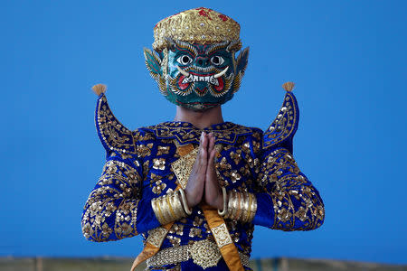 A dancer performs a masked theatre known as Lakhon Khol which was recently listed by UNESCO, the United Nations' cultural agency, as an intangible cultural heritage, along with neighbouring Thailand's version of the dance, known as Khon at the Wat Svay Andet buddhist temple in Kandal province, Cambodia, December 16, 2018. REUTERS/Samrang Pring