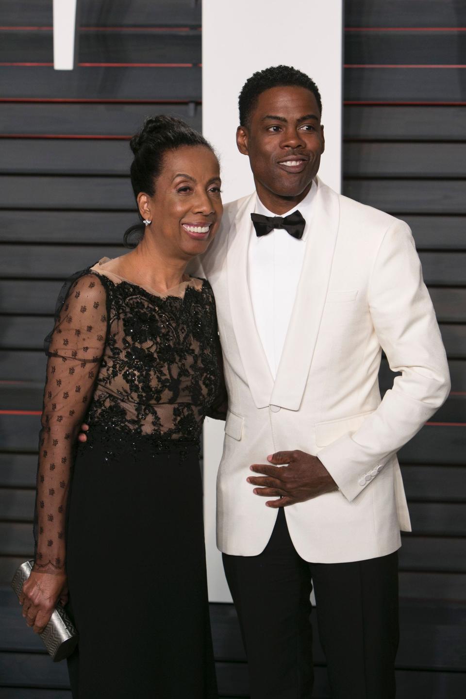 Chris Rock arrives with his mother, Rosalie Rock, at the Vanity Fair Oscar Party in Beverly Hills, California, on Feb. 28, 2016.