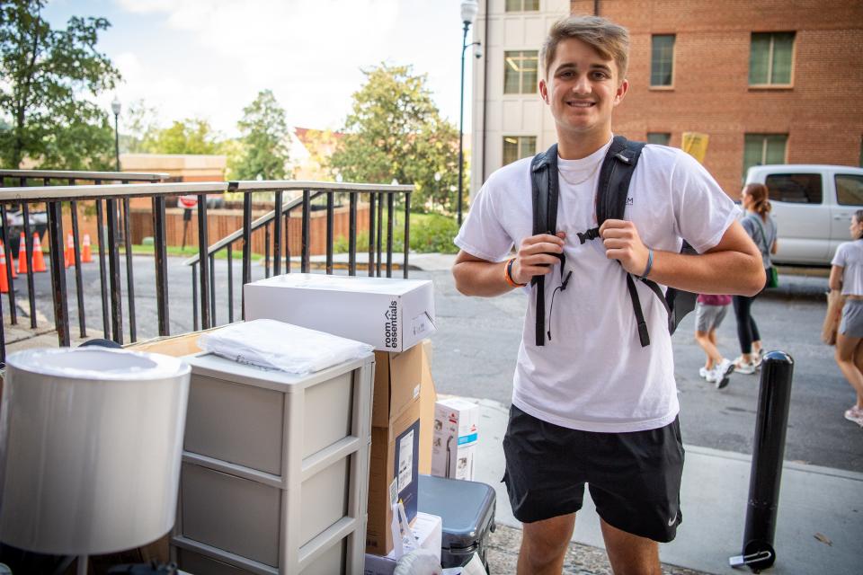 University of Tennessee freshman Landon Shaw is photographed with his belongings outside of Carrick Hall during move-in day on Wednesday, August 16, 2023.