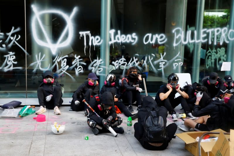 FILE PHOTO: Protesters clash with riot police in the campus of Hong Kong Polytechnic University in Hong Kong