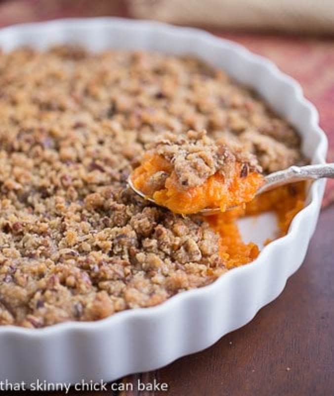 <p>That Skinny Chick Can Bake</p><p>Skip the marshmallows and top those sweet 'taters with a buttery, crumbly topping instead. </p><p><strong>Get the recipe: <a href="https://www.thatskinnychickcanbake.com/praline-topped-sweet-potato-casserole-plus-thanksgiving-side-dishes/" rel="nofollow noopener" target="_blank" data-ylk="slk:Praline Topped Sweet Potato Casserole;elm:context_link;itc:0;sec:content-canvas" class="link ">Praline Topped Sweet Potato Casserole</a> </strong></p>