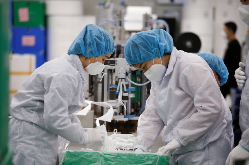 Employees work at a mask factory in Icheon