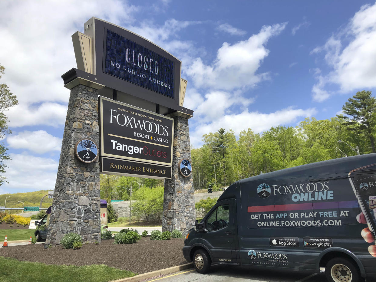 FILE — A van blocks a main entrance to Foxwoods Resort Casino, in Mashantucket, Conn., May 22, 2020. When the COVID-19 pandemic shuttered Connecticut's Foxwoods Resort Casino for three months in 2020, it reinforced something its owners, the Mashantucket Pequot Tribal Nation, had known for some time. After decades of relying heavily on gambling revenues to pay the bills, they needed more economic diversification. (AP Photo/Susan Haigh, File)