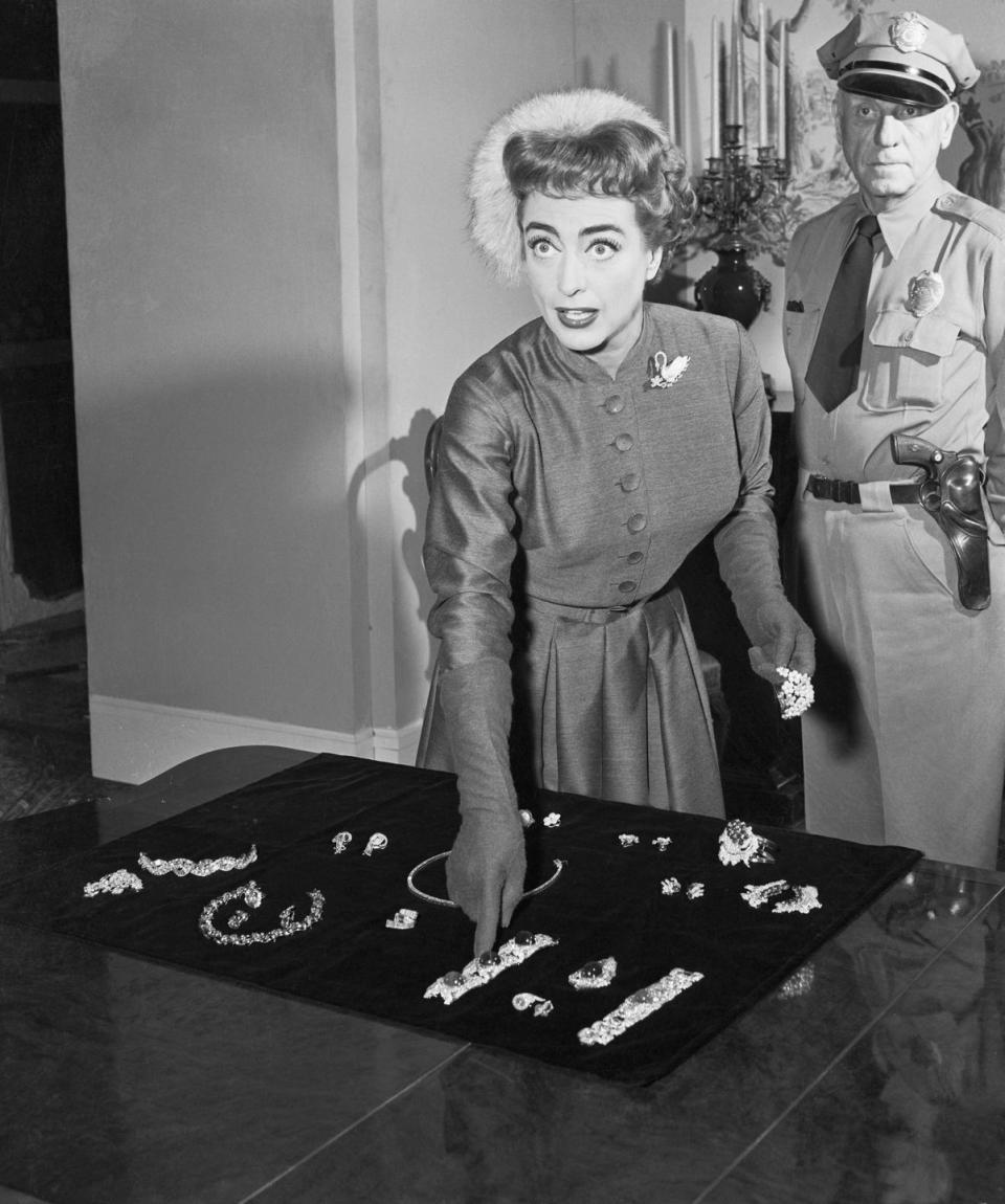 1955: Selecting jewelry on the set of 'Queen Bee'
