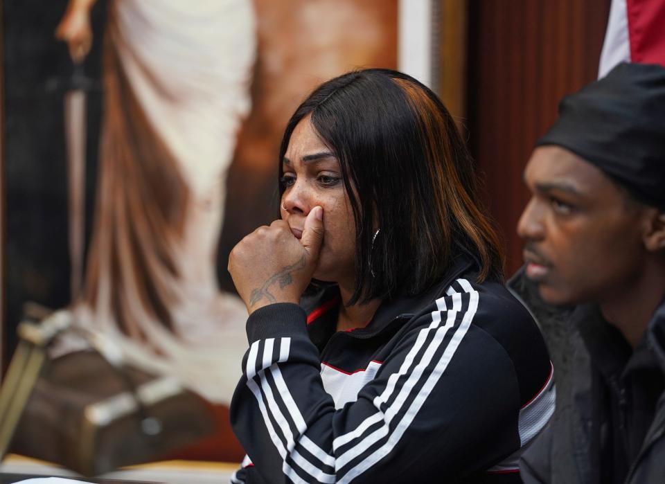 Quieauna Wilson, mother of the late Porter Burks, listens as attorney Geoffrey Fieger speaks during a press conference with the family of Burks at his office in Southfield on Wednesday, November 1, 2022. Fieger announced he would be filing a lawsuit on behalf of the family of the 20-year-old who was experiencing a mental health crisis while wielding a 3.5 inch knife before it was believed that 15 bullets may have struck and killed Porter after five Detroit police officers shot 38 rounds at Burks.