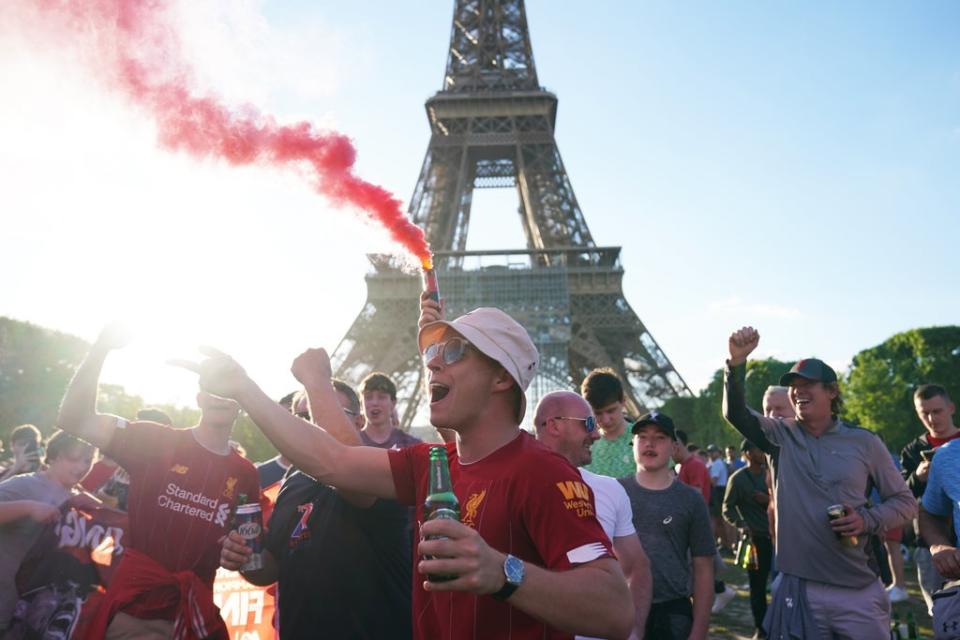 Liverpool football fans near the Eiffel Tower in Paris ahead of Saturday’s Uefa Champions League Final between Liverpool FC and Real Madrid (Jacob King/PA) (PA Wire)