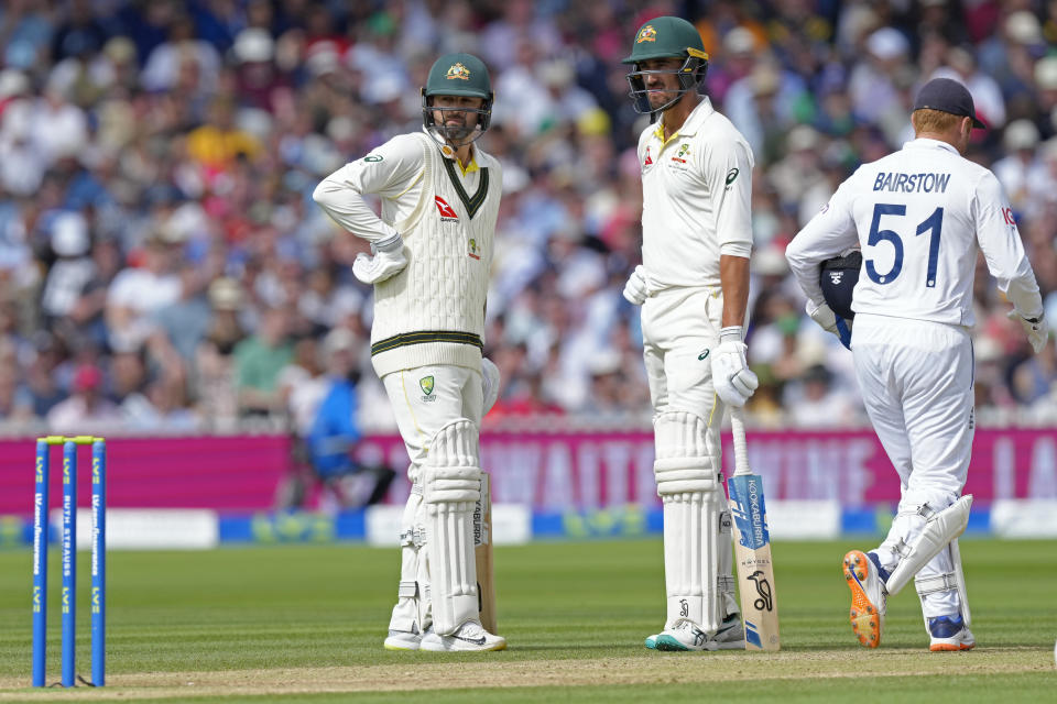 Australia's Nathan Lyon, left, stands with batting partner Mitchell Starc after walking to bat during the fourth day of the second Ashes Test match between England and Australia, at Lord's cricket ground in London, Saturday, July 1, 2023. (AP Photo/Kirsty Wigglesworth)