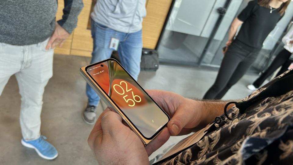 Man holding a Google Pixel 9 Pro folded