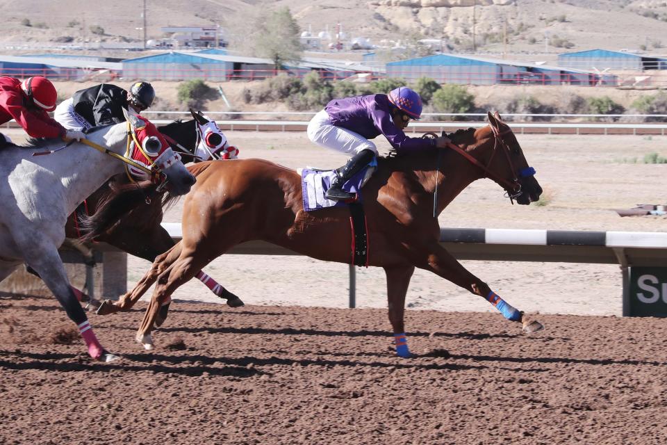 Sigur Ros, ridden by Ricardo Ramirez, edges clear of his rivals approaching the finish line in the SunRay Park Stakes, Saturday, May 14, 2022 at SunRay Park and Casino.