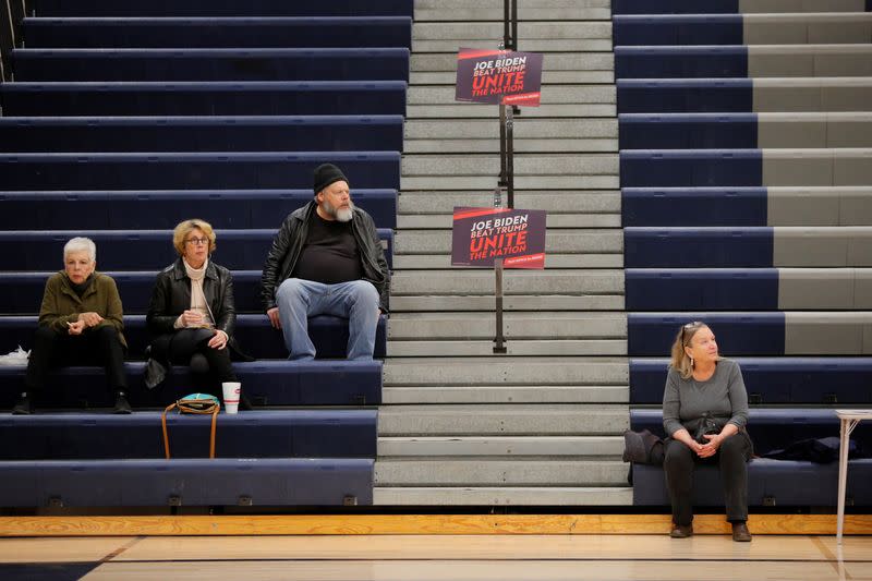 FILE PHOTO: Caucus goers wait in the corner for Democratic 2020 U.S. presidential candidate Biden at their caucus site in Des Moines