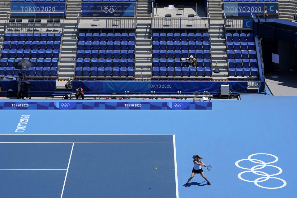 Mona Barthel, of Germany, returns to Iga Swiatek, of Poland, during the tennis competition at the 2020 Summer Olympics, Saturday, July 24, 2021, in Tokyo, Japan. (AP Photo/Patrick Semansky)