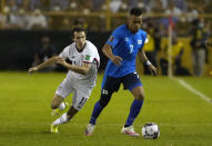 El Salvador's Darwin Ceren, right, is challenged by United States's Brenden Aaronson during a qualifying soccer match for the FIFA World Cup Qatar 2022 at Cuscatlan stadium in San Salvador, El Salvador, Thursday, Sept. 2, 2021. (AP Photo/Moises Castillo)