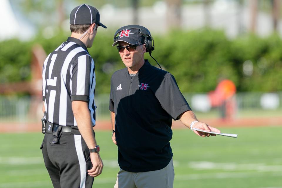 Nicholls coach Tim Rebowe talks with a game official during a game against North Alabama on Sept. 25 in Thibodaux.