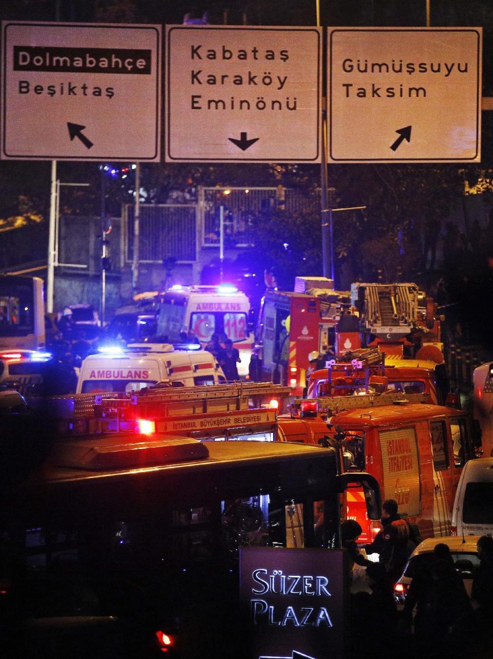 Rescue services work at the scene of explosions near the Besiktas football club stadium, in Istanbul, late Saturday, Dec. 10, 2016. Two loud explosions have been heard near the newly built soccer stadium and witnesses at the scene said gunfire could be heard in what appeared to have been an armed attack on police. Turkish authorities have banned distribution of images relating to the Istanbul explosions within Turkey. (AP Photo/Emrah Gurel) TURKEY OUT