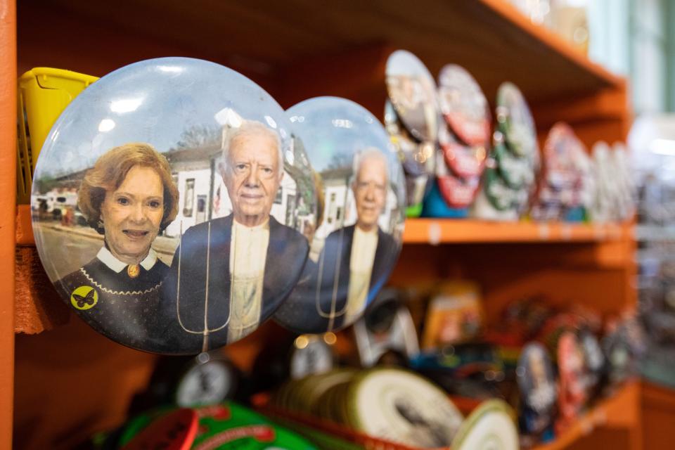 Buttons sold at Plains Trading Post depict former president Jimmy Carter and former first lady Rosalynn Carter depict the couple as the two shown in the artwork ÒAmerican Gothic.Ó