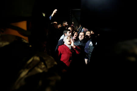 FILE PHOTO: Protesters chant slogans during a protest against tax hikes in Amman, Jordan November 30, 2018. REUTERS/Muhammad Hamed/File Photo