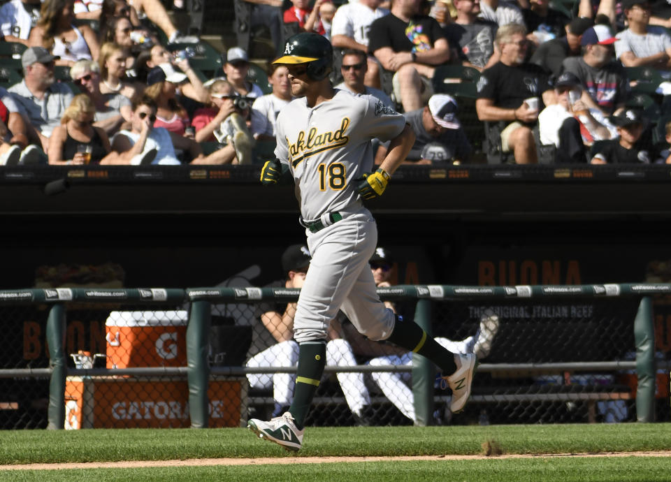 Oakland Athletics' Chad Pinder (18) runs the bases after hitting a two-run home run against the Chicago White Sox during the eighth inning of a baseball game, Friday, Aug. 9, 2019, in Chicago. (AP Photo/David Banks)
