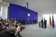 Germany's Chancellor Olaf Scholz, right, and Ukraine's President Volodymyr Zelenskyy address a media conference at the chancellery in Berlin, Germany, Sunday, May 14, 2023. Ukrainian President Volodymyr Zelenskyy arrived in Berlin early Sunday for talks with German leaders about further arms deliveries to help his country fend off the Russian invasion and rebuild what's been destroyed by more than a year of devastating conflict. (AP Photo/Markus Schreiber)