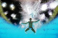 Tom Daley of Great Britain competes in the Men's 10m Platform Diving Semifinal on Day 15 of the London 2012 Olympic Games at the Aquatics Centre on August 11, 2012 in London, England. (Photo by Clive Rose/Getty Images)