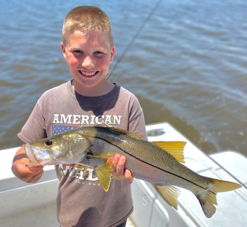 Capt. Jeff Patterson caught a big smile when this kid caught a nice snook on a recent charter aboard the Pole Dancer.