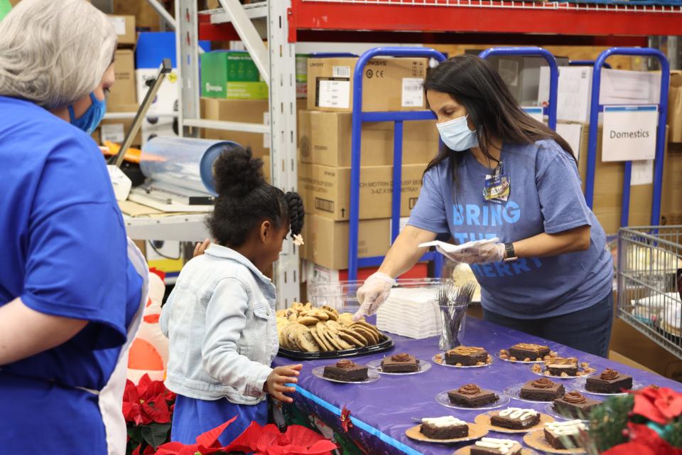 A Positive Tomorrows student chooses dessert at a meal presented to families as part of a special holiday surprise. Kevin Hart, Laugh Out Loud and Sam's Club gave Oklahoma City's Positive Tomorrows, a school serving homeless youth and their families, a donation and gifts on Nov. 23.