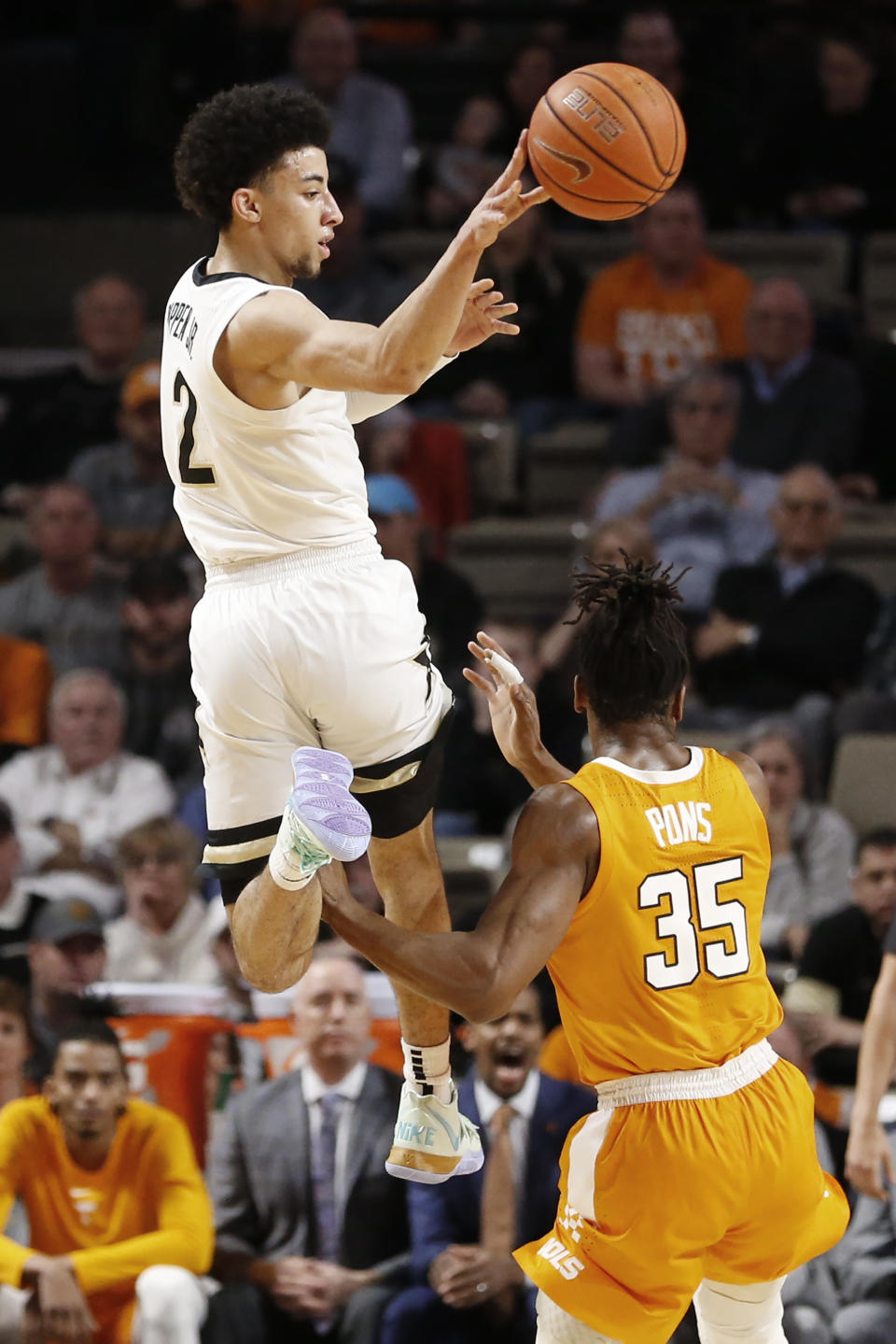 Vanderbilt guard Scotty Pippen Jr. (2) passes the ball over Tennessee guard Yves Pons (35) during the first half of an NCAA college basketball game Saturday, Jan. 18, 2020, in Nashville, Tenn. Tennessee won 66-45. (AP Photo/Mark Humphrey)