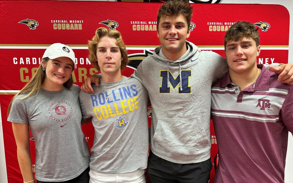 Cardinal Mooney Catholic's Kate Ruona (Florida State), Sean Laureano (Rollins), Jack MacKinnon (Michigan State) and JR Rosenberg (Texas A&M) sign their letters of intent Wedneday, April 19, 2023, at the school.