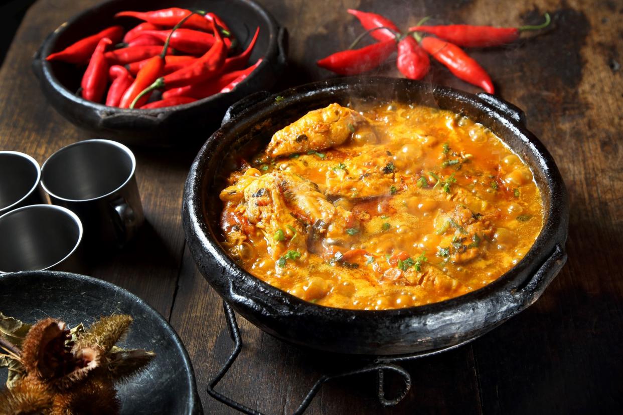 moqueca capixaba, a typical dish from the Brazilian region, made with fish, herbs, spices and annatto